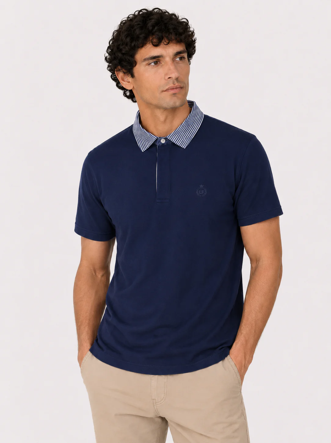 Polo in cotone con colletto goffrato a righe